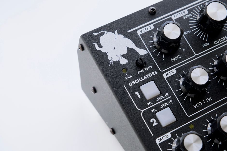 Detailed view of a synthesizer with knobs and oscillators, showcasing electronic music equipment.